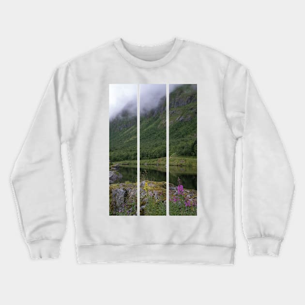 Wonderful landscapes in Norway. Senja, Nordland. Beautiful scenery of a valley with lupine flowers on the rocks. Mirror in the lake. Cloudy summer day. Fog and mountains in background (vertical) Crewneck Sweatshirt by fabbroni-art